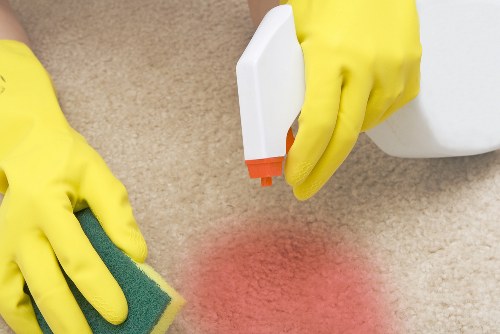 Domestic cleaner preparing a tidy KT2 home for a regular house clean
