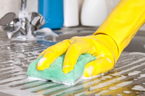 Deep cleaning oven racks and trays during a KT2 appliance clean