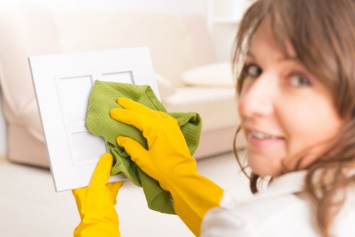 Professional carpet cleaner working in a KT2 residential property